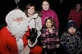 Santa switches on Christmas lights