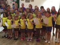 Brownies, Guides sing to save sport