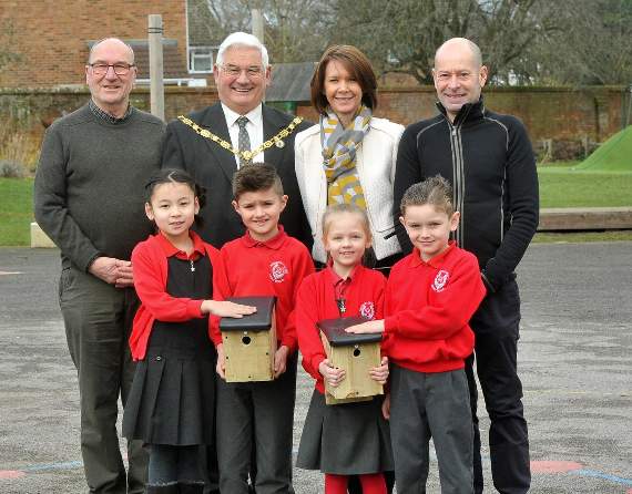 Mayor of Farnham David Attfield, headteacher Gemma Ball and pupils, flanked by members of the Tice’s Meadow Bird Group