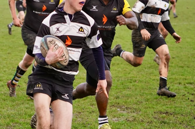 Vandal full back Tom Clarke shows a clean pair of heels to FRUFC chair of selectors Jemi Akin Olugbade