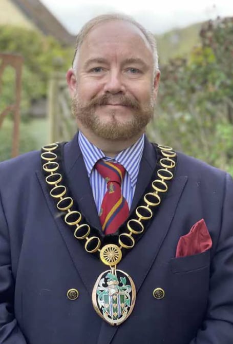 Whitehill & Bordon councillor Adam Carew wearing the chain of the chairman of East Hampshire District Council