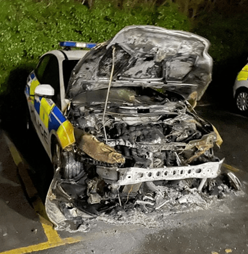 Hampshire Police is appealing for witnesses to come forward after a police car was set on fire in the car park at Alton Police Station on Monday