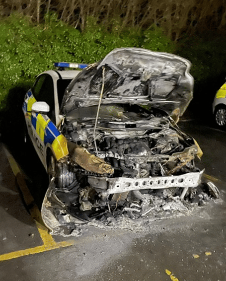 Hampshire Police is appealing for witnesses to come forward after a police car was set on fire in the car park at Alton Police Station on Monday