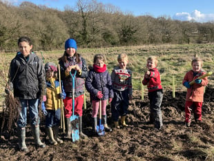 Children get digging to create a hedge at Blacknest Fields