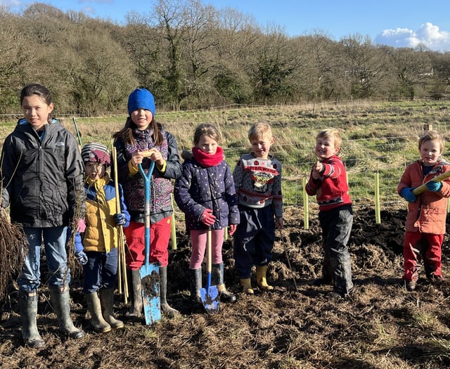 Children get digging to create a hedge at Blacknest Fields