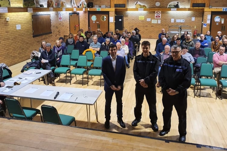 Cllr Andy Tree (foreground, left) and Sgt Simeon Poulton (foreground, centre) at a public meeting in Bordon in January 2020