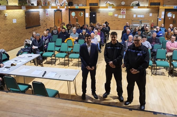 Cllr Andy Tree (foreground, left) and Sgt Simeon Poulton (foreground, centre) at a public meeting in Bordon in January 2020