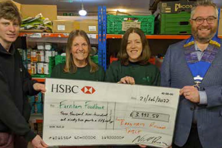 Farnham Round Table presents Santa’s Sleigh Ride cheque to Farnham Foodbank, March 2022