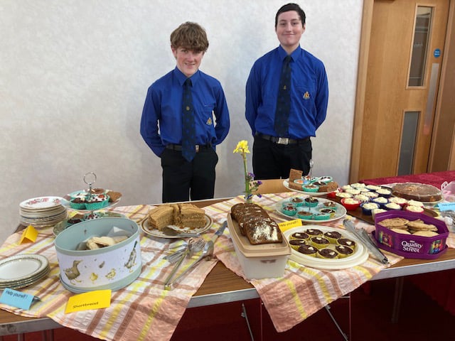 2nd Alton Boys Brigade members Jacob Gibbs and Andrew Bentley with some of their baking for an afternoon tea at Alton Methodist Church to raise money for Ukrainian refugees, March 2022.