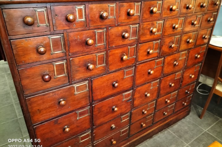 An apothecary cabinet auctioned by Resurrection Furniture in Alton to help Ukrainian refugees