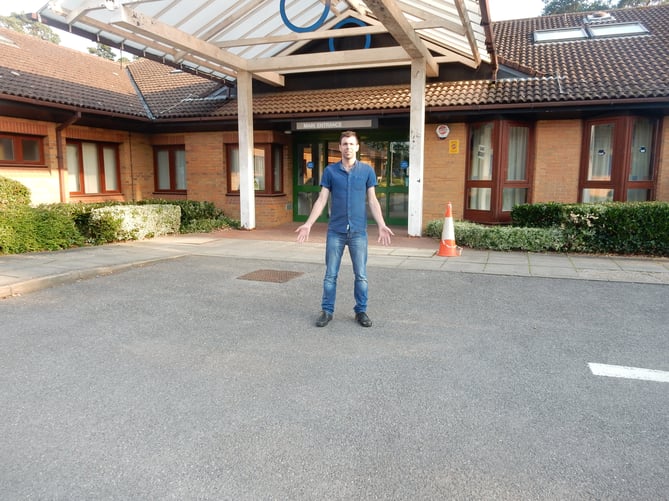 Cllr Andy Tree outside Chase Community Hospital in Bordon
