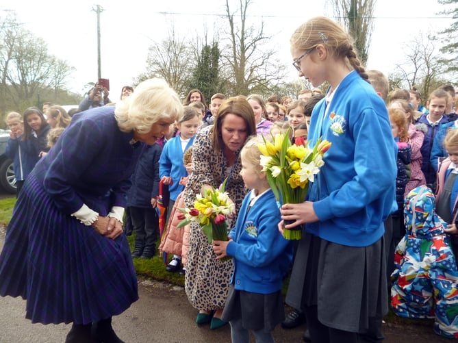 The Duchess of Cornwall receives flowers from Chawton CE Primary School pupils Cecily Hook, four, and Holly Bayliss, 11, as she visits Jane Austen’s House in Chawton on April 6th 2022.