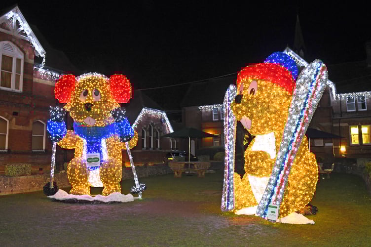 TINDLE CHRISTMAS ALTON                                      MRW                               1/12/2020

Christmas this year sees not one but two 16ft illuminated Marmots outside the Assembly Rooms in Alton

(left) 'Marmite' with (right) 'Meribel' joined by Alton sisters Evie Eggby (10) and Elsie Eggby (5)

Picture:  Malcolm Wells (201201-0141)
Professional Photographer