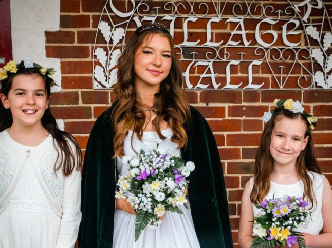 May Queen Kaitlyn Nicholson with her senior attendants Charlotte King and Madeline Lucus at the Oakhanger May Fayre 2022.