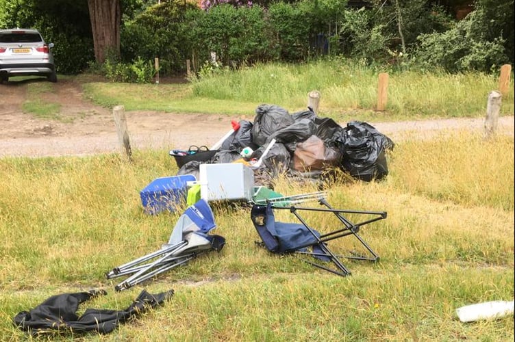 Some of the rubbish left after a traveller encampment vacated Shortfield Common, Frensham, on Saturday