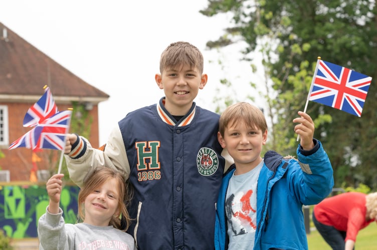 Flag-waving children at The Big Lunch for the Queen’s Platinum Jubilee at The Shed in Bordon on June 5th 2022.