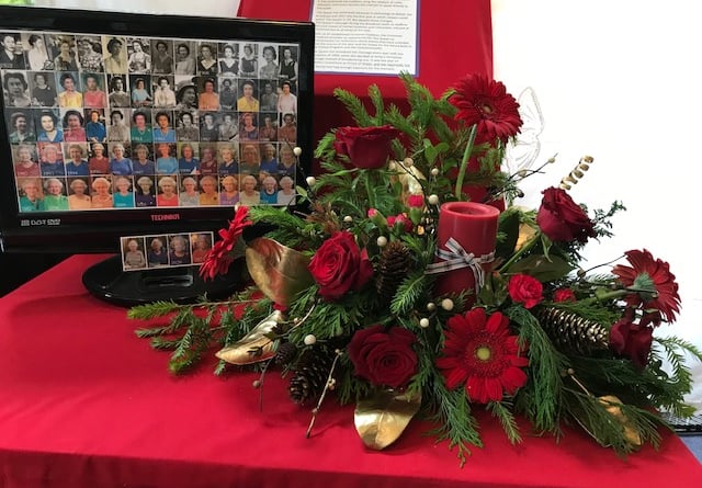 The changing face of the Queen from 1952 to 2022 was displayed on a computer screen next to flowers during the Platinum Jubilee flower festival at the Church of the Good Shepherd in Four Marks.