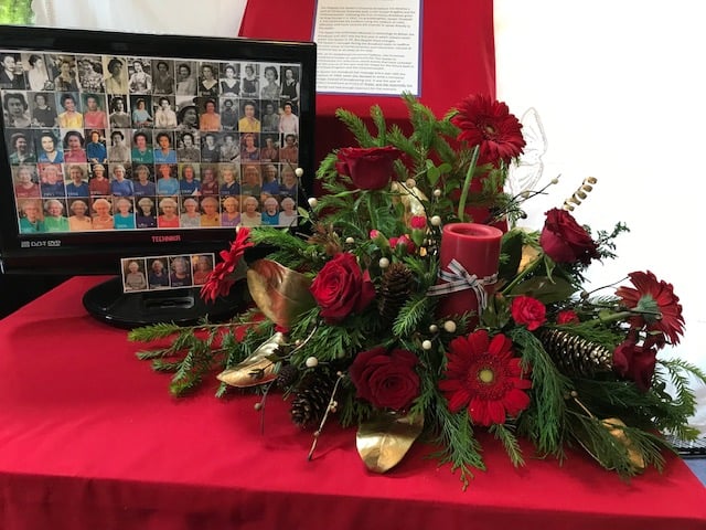 The changing face of the Queen from 1952 to 2022 was displayed on a computer screen next to flowers during the Platinum Jubilee flower festival at the Church of the Good Shepherd in Four Marks.