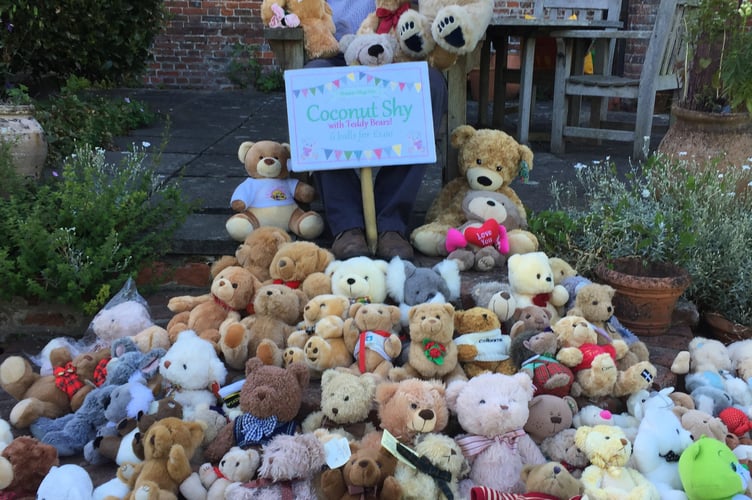 Ian Champness with the teddy bears to be won in a teddy bear coconut shy at Shalden village fete on June 19th 2022.