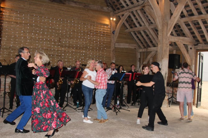 Guests at a fundraising evening for Home-Start Winchester dance to the Kasbah Swing Band at Pinglestone Barn in Old Alresford, June 2022.