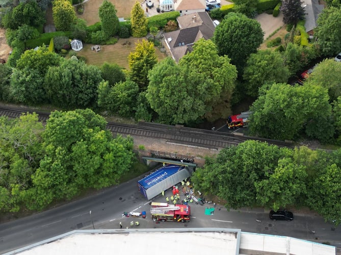 Emergency services on the scene at the A325 Wrecclesham railway bridge after an HGV struck the bridge at around 6.15pm on Monday