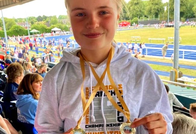 Highfield & Brookham Schools pupil Emily Sherlock, 12, with the 100m and long jump gold medals she won at the National Prep Schools Athletics Championships at the Alexander Stadium in Birmingham, July 2022.