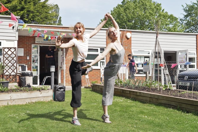 Daisy May Kemp and Bryony Wood perform a Doorstep Duet at Hale Community Centre in Farnham.