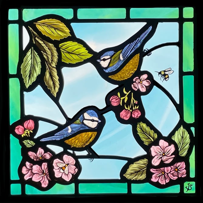 Artist Jessica Stroud’s stained glass work Blue Tits in the Apple Tree