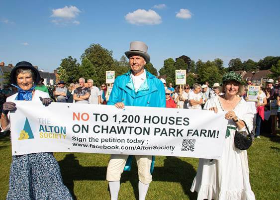 Regency-themed protest against plans to build 1,200 houses at Chawton Park Farm in September 2021.