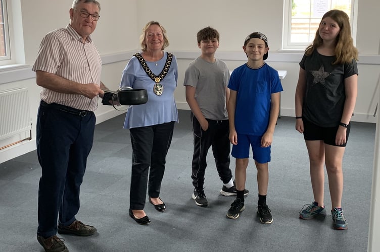 From left: Cllr Paul Wigman, Cllr Sally Pond, and Kaylen, Oliver and Liberty, who took part in a cookery course at Café 1759 in Bordon in June and July 2022.