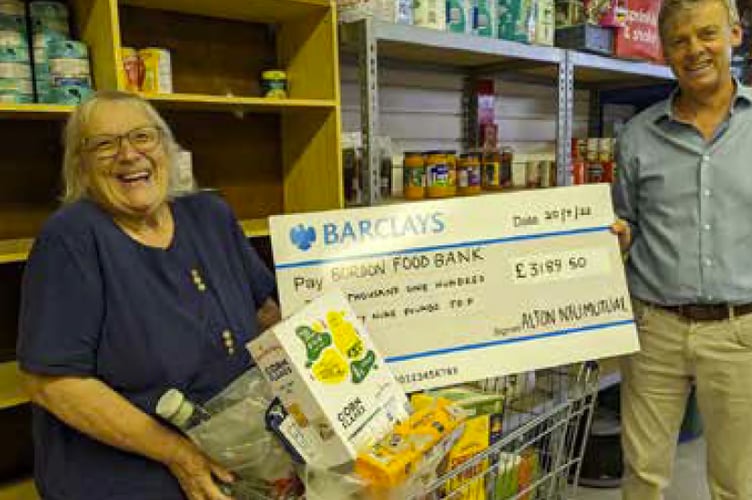 NFU Mutual Alton presents a cheque to Bordon food bank.