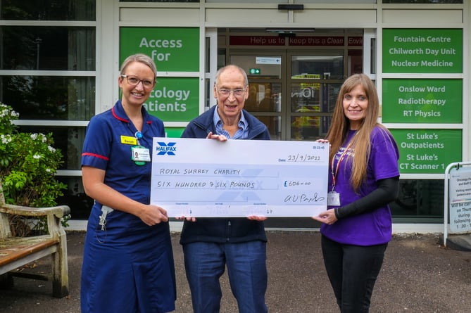 Alan Parks presents a sponsored walk proceeds cheque for £606 to Sarah Etherington, left, and Sandra Lowrey of the Royal Surrey Charity on September 23rd 2022.