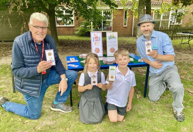 Phil Bates (left), pupils Lola and Rory and headteacher Richard Austin