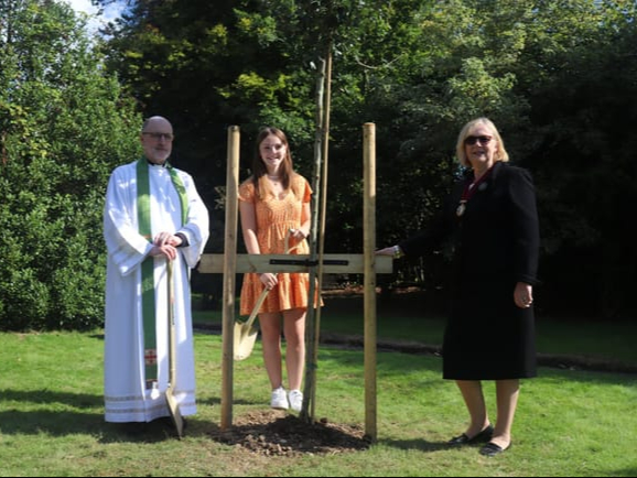 Rev Nicolas Haigh (left), Millie Owles and Fernhurst Parish Council chairman Heather Bicknell planted the tree