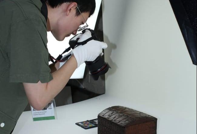 Student Anson Yu at work photographing some of the Icelandic collection