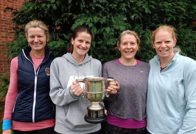 Holding the ladies’ Premier Division trophy are Caroline Weaver, Catherine Mckeracher, Victoria Brown and Jackie West