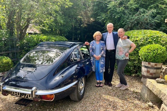 Francis Rossi and his E-Type Jag flanked by Antiques Warehouse owners Hilary (left) and Rachel Burroughs
