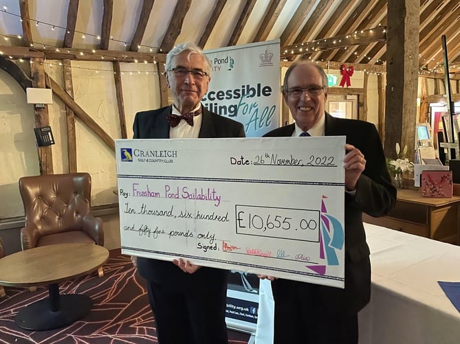 Simon Crowther and Ivor Barrett receiving the cheque