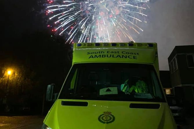 Ambulance lit by firework 