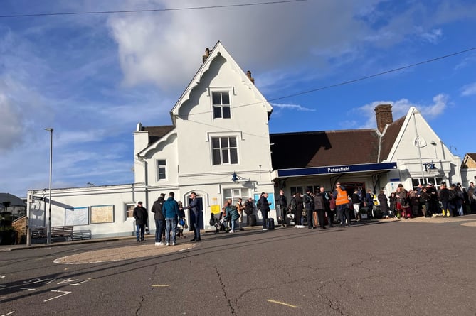 travelers at Petersfield rail station 