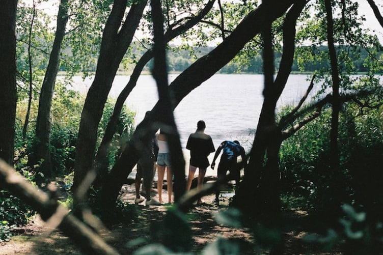 Andre Squire (Andre), Gemma Champness (Addie), Kimesha Campbell (Loreece) and Andrew Gichigi (Aaron) film the movie Wall Cries at Frensham Ponds.