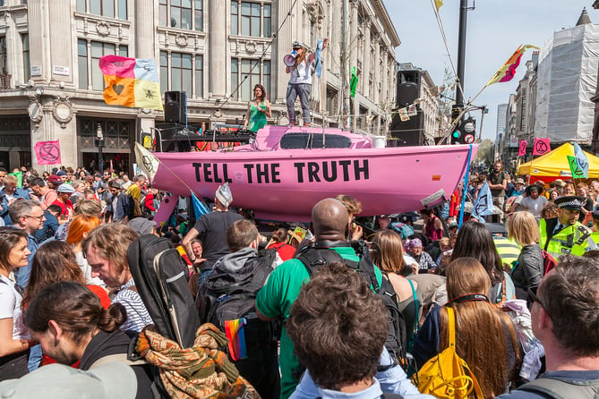 Extinction Rebellion's famous pink protest boat, pictured during a 2019 protest in Oxford Circus, will visit Farnham, Guildford and Godalming this Saturday