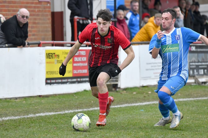 Alex Barsa goes on a run for Petersfield Town