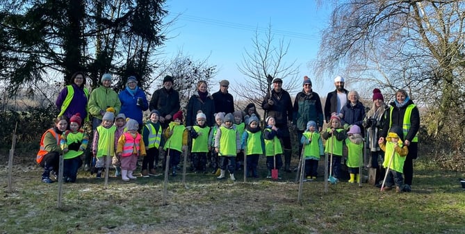 The Queen's Green Canopy project tree planters, Shalden Recreation Ground, February 2023.