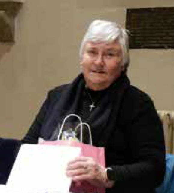 Madeline King with gifts after retiring as bell tower secretary of St Peter's Church in Petersfield, February 2023.