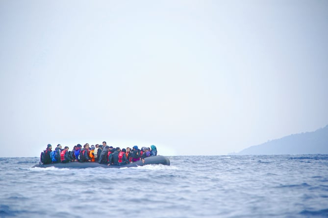 Refugees on a boat crossing the Mediterranean sea, heading from Turkish coast to the northeastern Greek island of Lesbos, 29 January 2016.