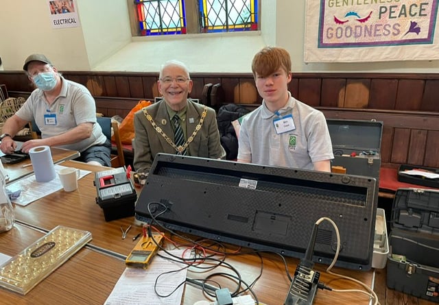 The mayor of Farnham at last month's Farnham Repair Cafe session with a 15 year old volunteer repairer whose dream is to become an aeronautical engineer