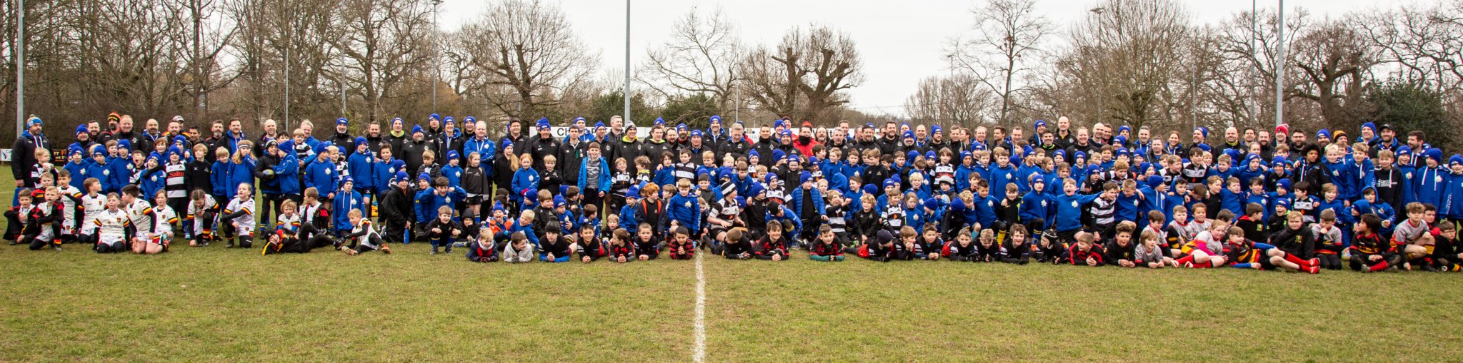 The 2023 Farnham Rugby Club Mini Tour players and coaches line up with some of the opposition from Chard