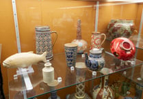 Researchers looking at ceramics collection at Allen Gallery in Alton
