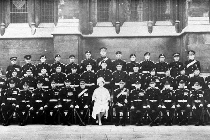 The Queen Mother sat with an unknown regiment at an unknown occasion sometime after the Second World War – can you help unravel the photograph's mysteries?